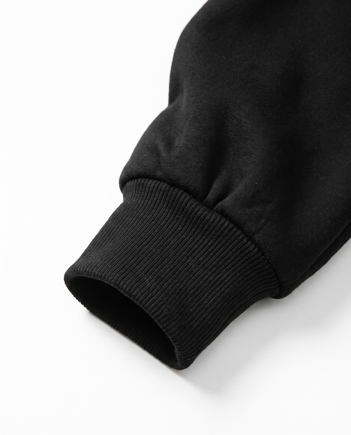 Sweat col rond coton molletonné noir - gros plan poignet