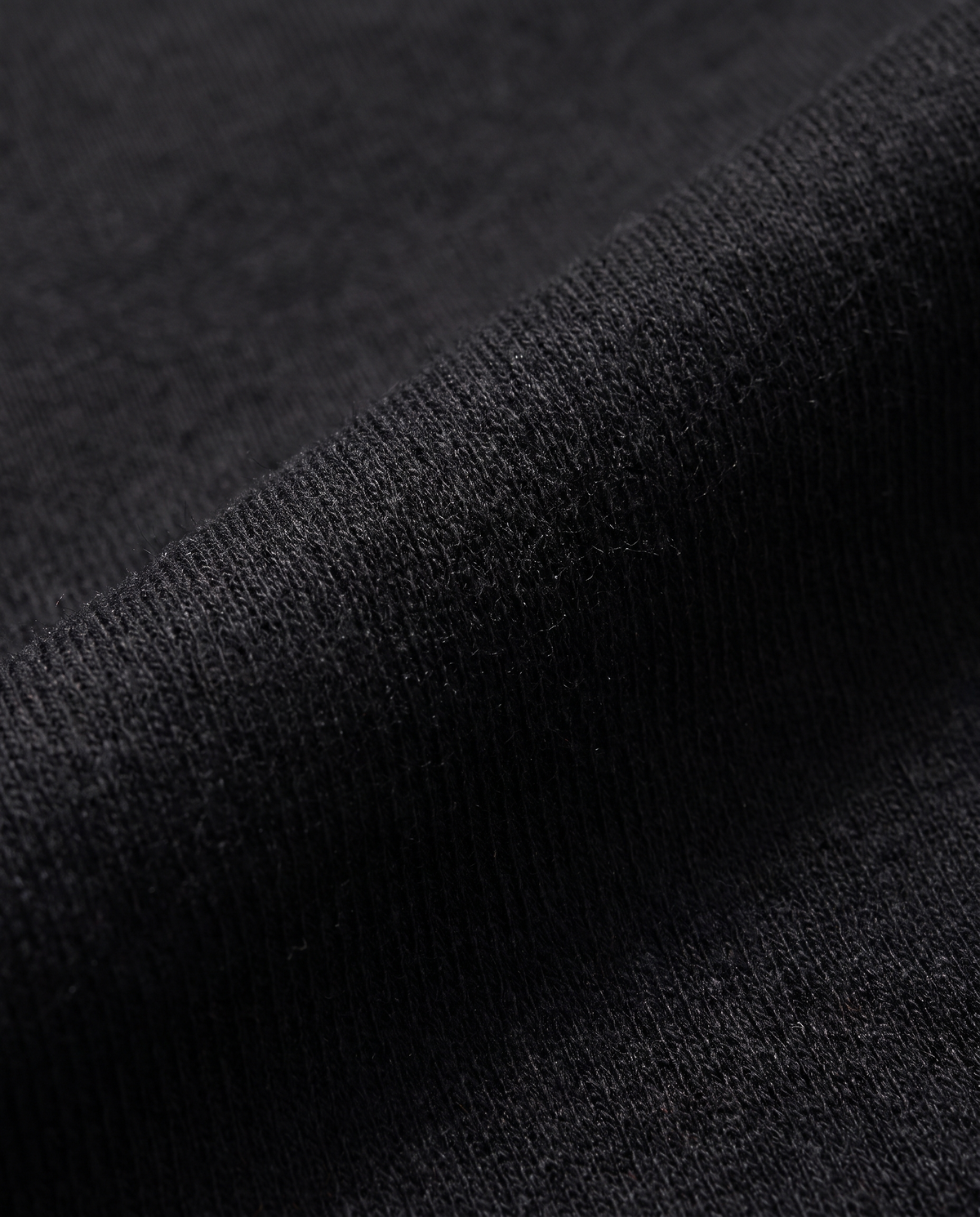 Sweat col rond coton molletonné noir - gros plan tissu